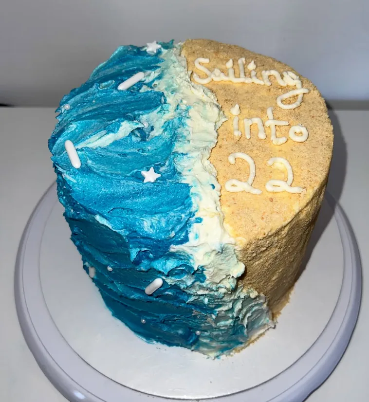 Sailing into 22 beach themed cake